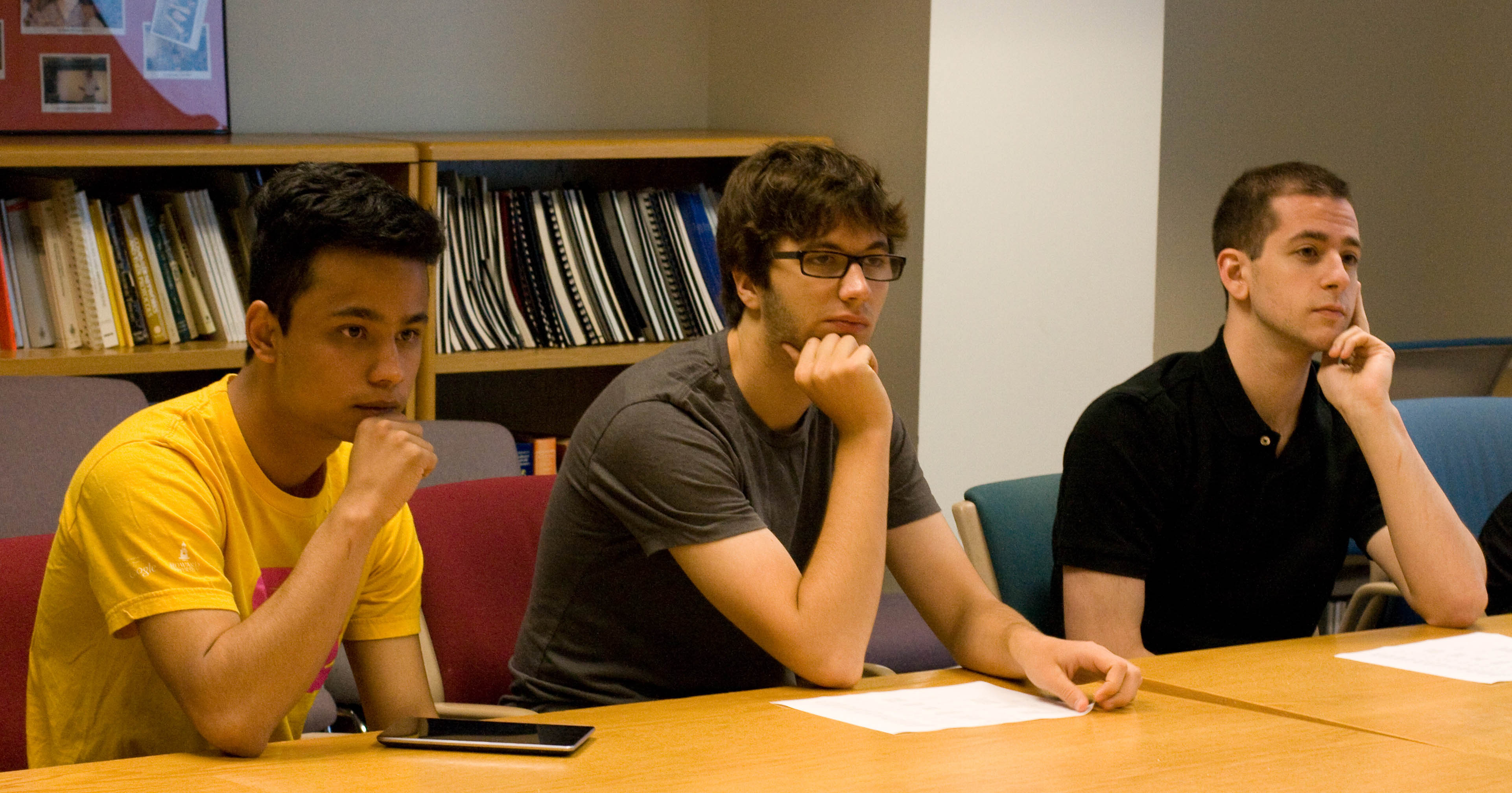 REU students Roshan
      Thapaliya (left), Jacob McNamara (center), and Leo Behe (right).